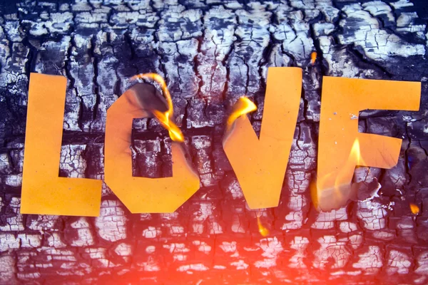 Burning paper love inscription — Stock Photo, Image