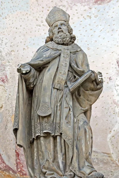 Metalen figuur van een priester — Stockfoto