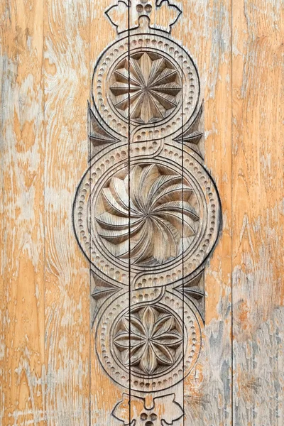 Wooden surface with carvings — Stock Photo, Image