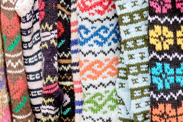 Row of colorful knitted socks — Stock Photo, Image