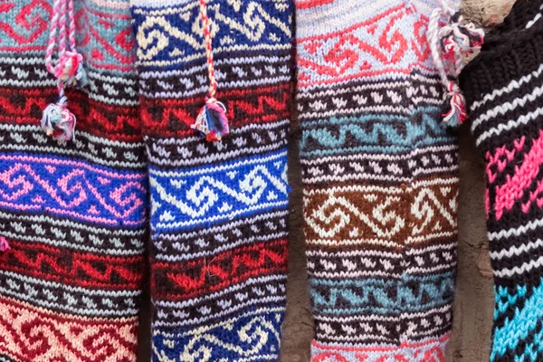 Row of colorful knitted socks — Stock Photo, Image