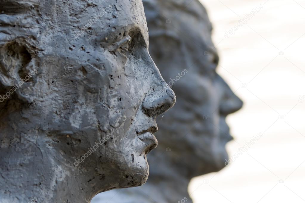 Sculptures of two people profile