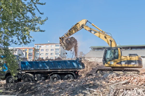 Cargo crane raking blockages — Stock Photo, Image