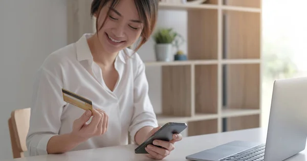 Mobile banking, Online shopping, digital banking, internet payment concept. Woman hand using mobile smart phone payments and credit card for online shoppin