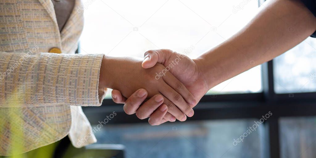 Close up of Business people shaking hands, finishing up meeting, business etiquette, congratulation, merger and acquisition concept