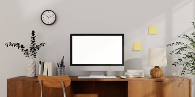 Düzenli bir çalışma alanı, bitkiler ve uzak çalışma için ideal modern bir bilgisayara sahip minimalist bir ev ofisi..