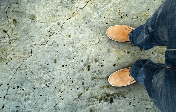 Yellow boots on the road — Stock Photo, Image