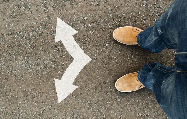 Yellow boots on the road — Stock Photo, Image