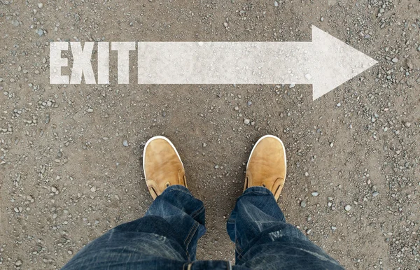 Man on a road with the word welcome. — Stock Photo, Image