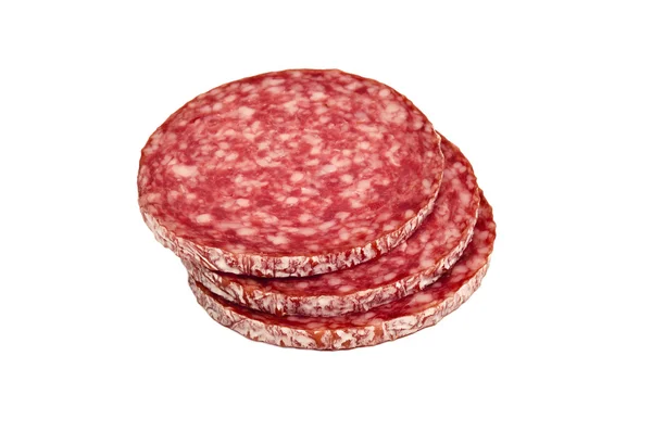 Segmenten van salami, geïsoleerd op een witte achtergrond. — Stockfoto