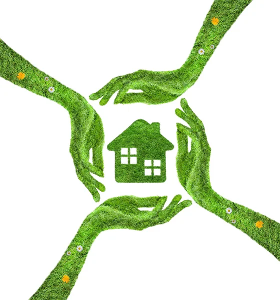 Grass home icon, in his hands. — Stock Photo, Image