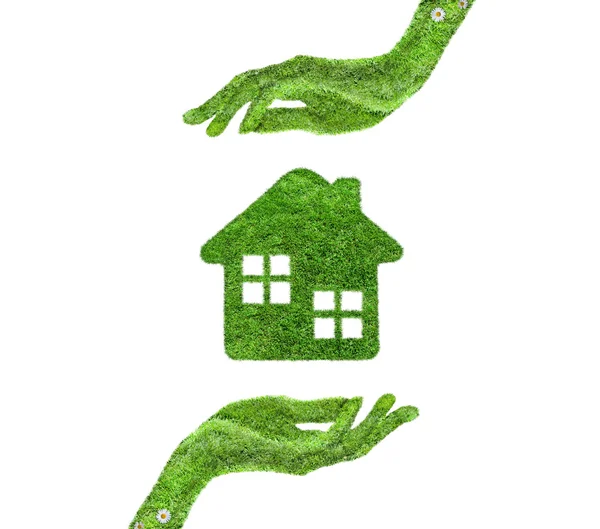 Grass home icon, in his hands. — Stock Photo, Image