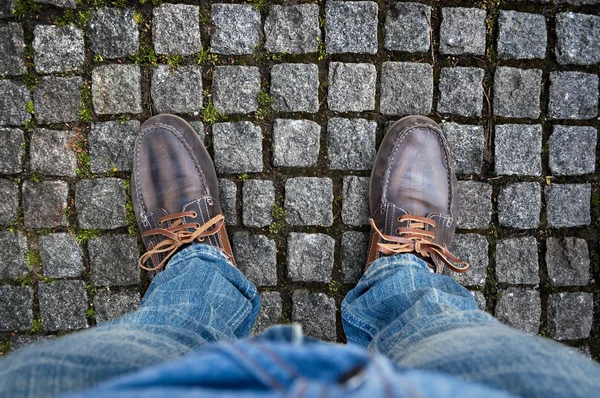 Brown boots on the road — Stock Photo, Image