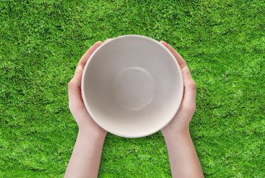 Empty plate in hand clipart