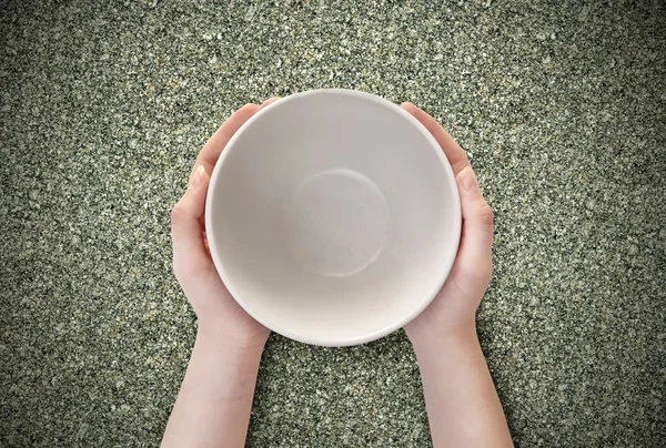 Empty plate in hand