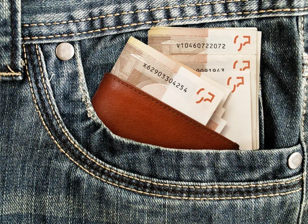 Penger i jeans – stockfoto