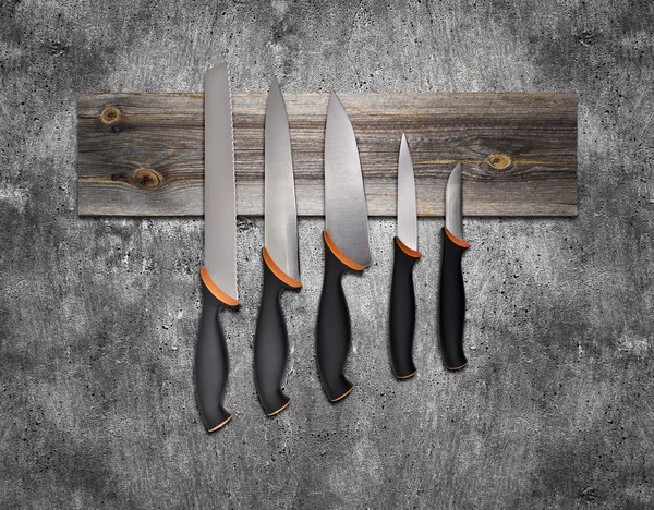 Set of kitchen knives on board — Stock Photo, Image