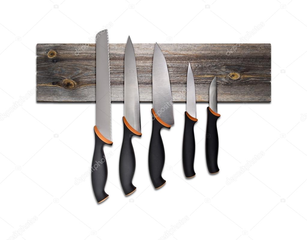 Set of kitchen knives on board