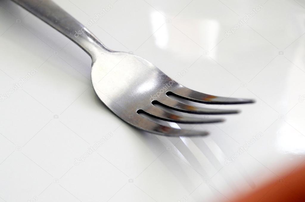 Fork on the empty plate. — Stock Photo © chekman1 93558800