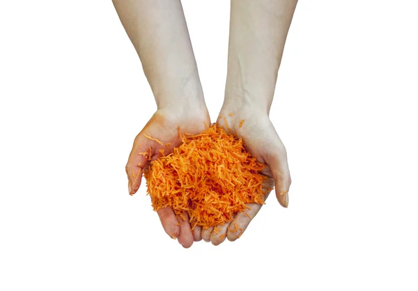 Grated carrots in hands. — Stock Photo, Image