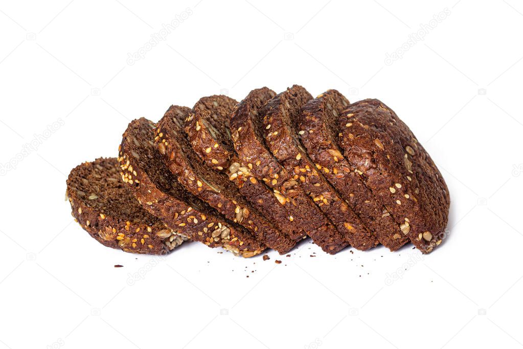 Sliced grain bread made from barley and rye, with seeds and nuts inside, isolated on a white background