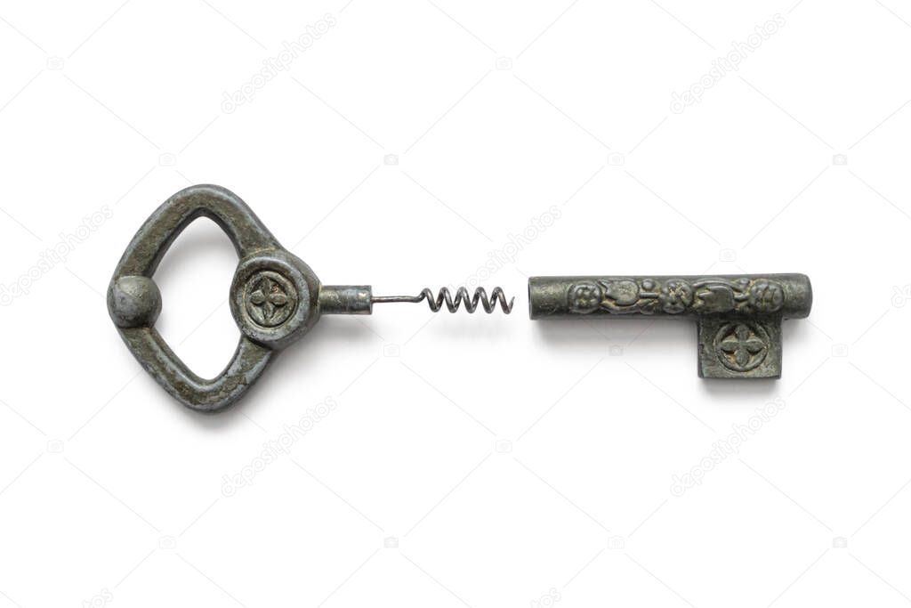 Vintage corkscrew in the form of a key made of old oxidized metal with a pattern, isolated on a white background
