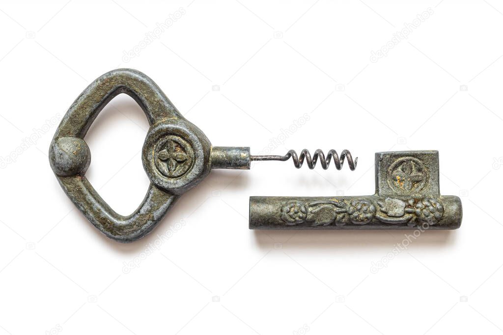 Old corkscrew in the form of a key with a screw metal rod, for uncorking bottles, isolated on a white background