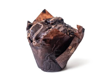 Delicious chocolate muffin with icing in brown parchment paper, isolated on a white background