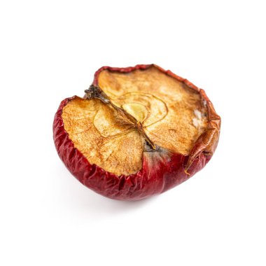 An apple core. An old dried apple, cut in half on a white background clipart