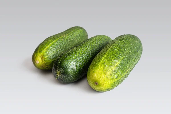 Three Ripe Green Cucumbers Making Vegetable Salad Lie Light Surface — Stock Photo, Image