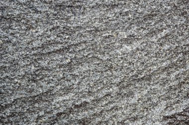 Gri granitin işlenmemiş doğal dokusu. Soyut arkaplan, doku, kalıp, duvar kağıdı.