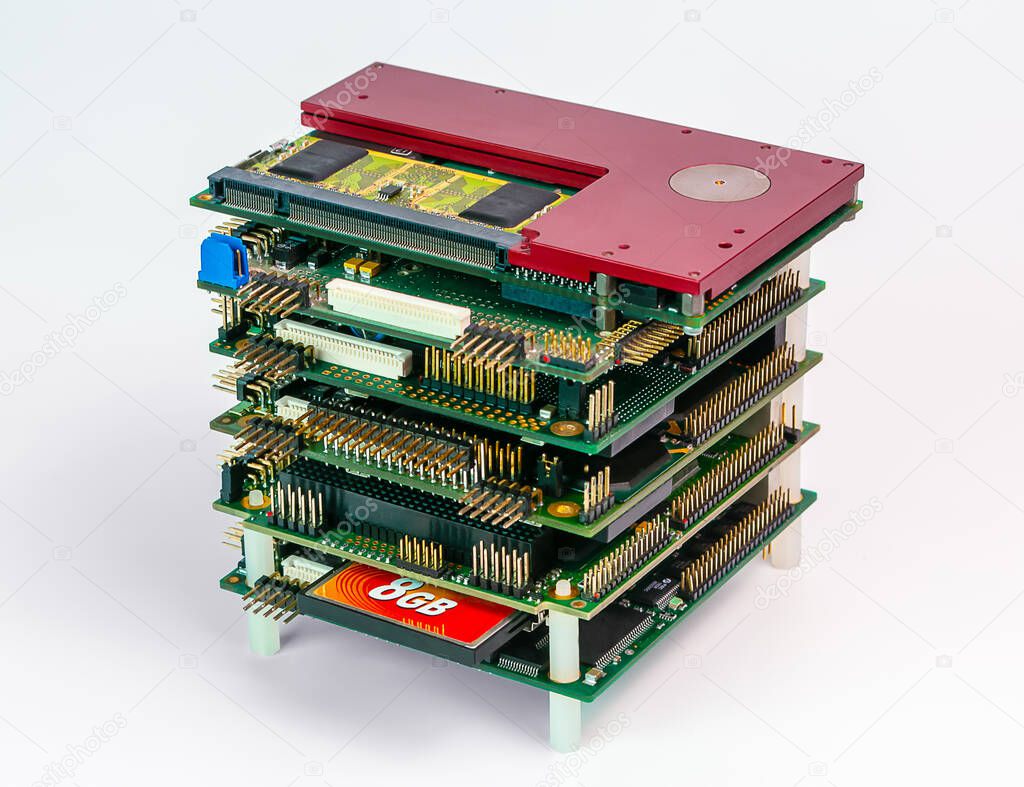 pc104 stack of rugged embedded computer boards on white background