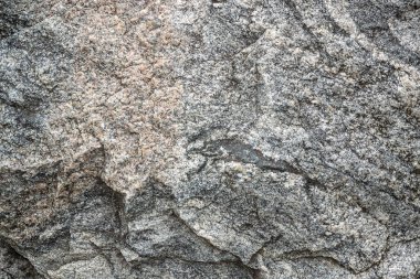 Gri granitin işlenmemiş doğal dokusu. Soyut arkaplan, doku, kalıp, duvar kağıdı.