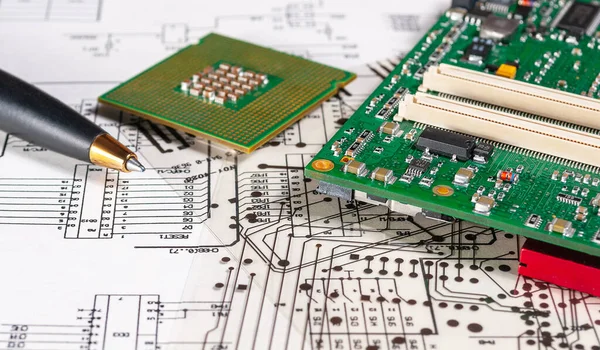 Electronic board, pen, processor and radio components lie on the background of an schematic circuit diagramm and a photomask for the manufacture of printed circuit boards. Concept for the development and design of electronic devices.
