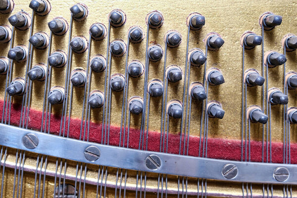 View inside of an old piano, repair and tuning of keyboard musical instruments