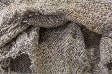 Çuval bezinin dokusu. Kırışıklıkları ve gölgeleri olan doğal yaşlı keten dokusu.