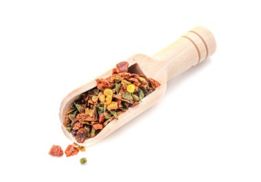 Spice mix in a wooden scoop isolated on a white background