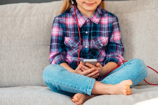 Beautiful little girl in headphones — Stock Photo, Image