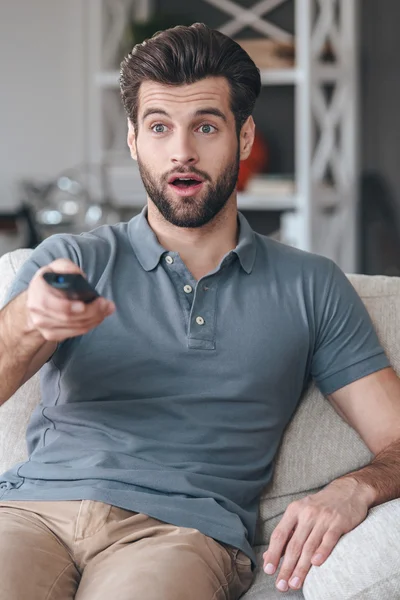 Man holding remote control — Stock Photo, Image