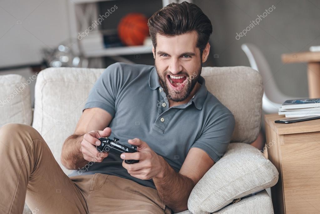 Premium Photo  Handsome man play with game console modern technology and  engineering video game console guy playing on console it is my hobby  inveterate gamer time for party fun