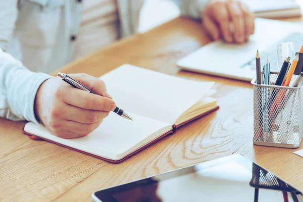 Male hands making notes Royalty Free Stock Images