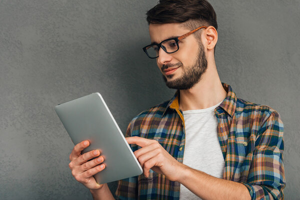 man using digital tablet