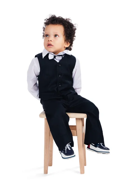 Baby boy sitting on chair — Stock Photo, Image