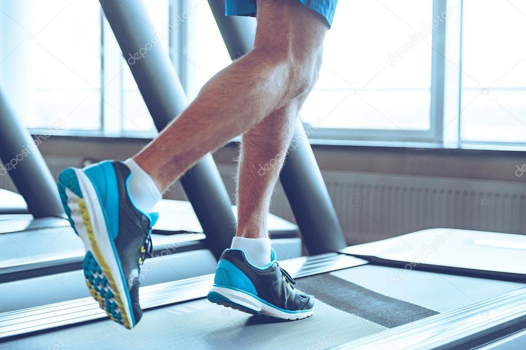 legs running on treadmill
