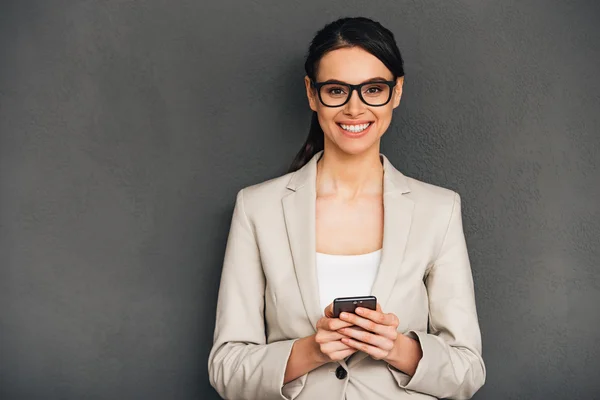 Businesswoman with smart phone — Stock Photo, Image
