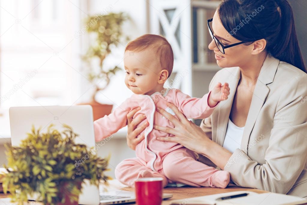 Young businesswoman with baby