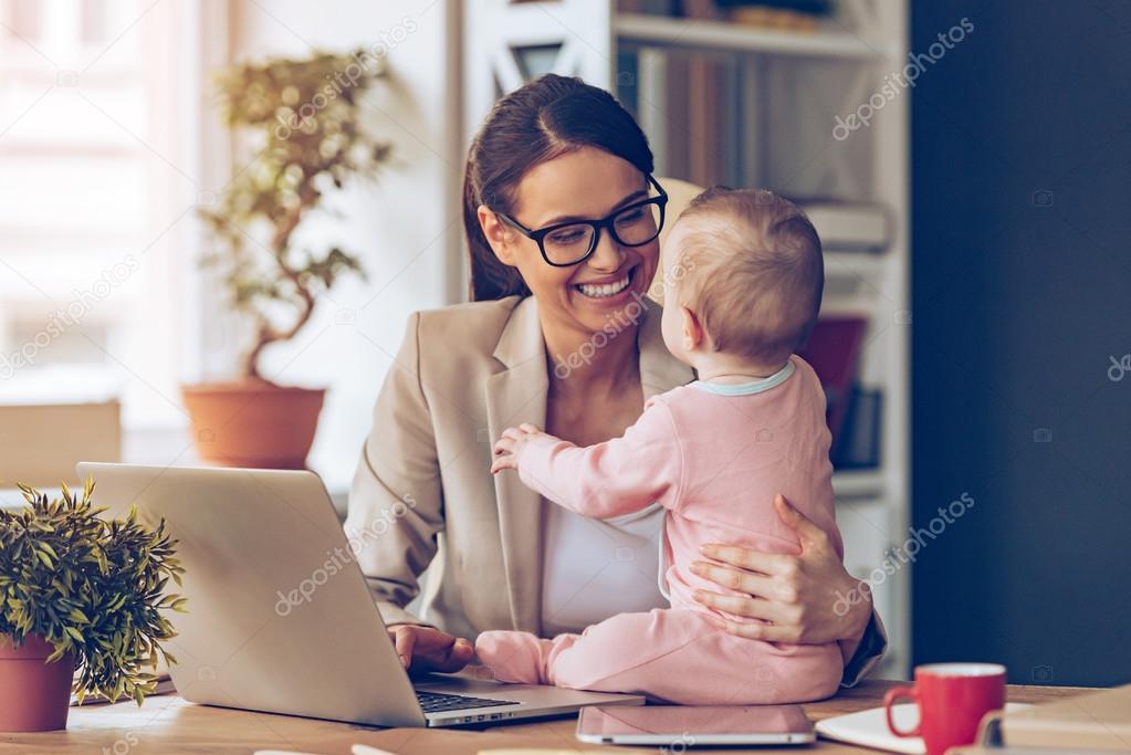 Young businesswoman with baby