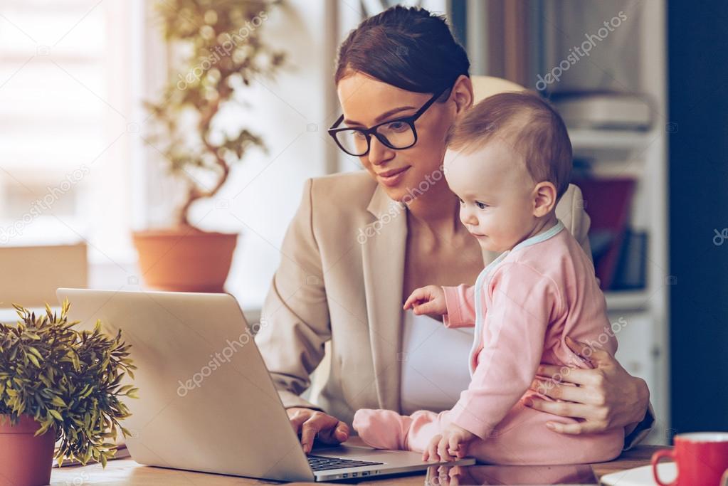 Young businesswoman with baby
