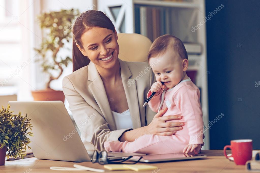 Young businesswoman with baby