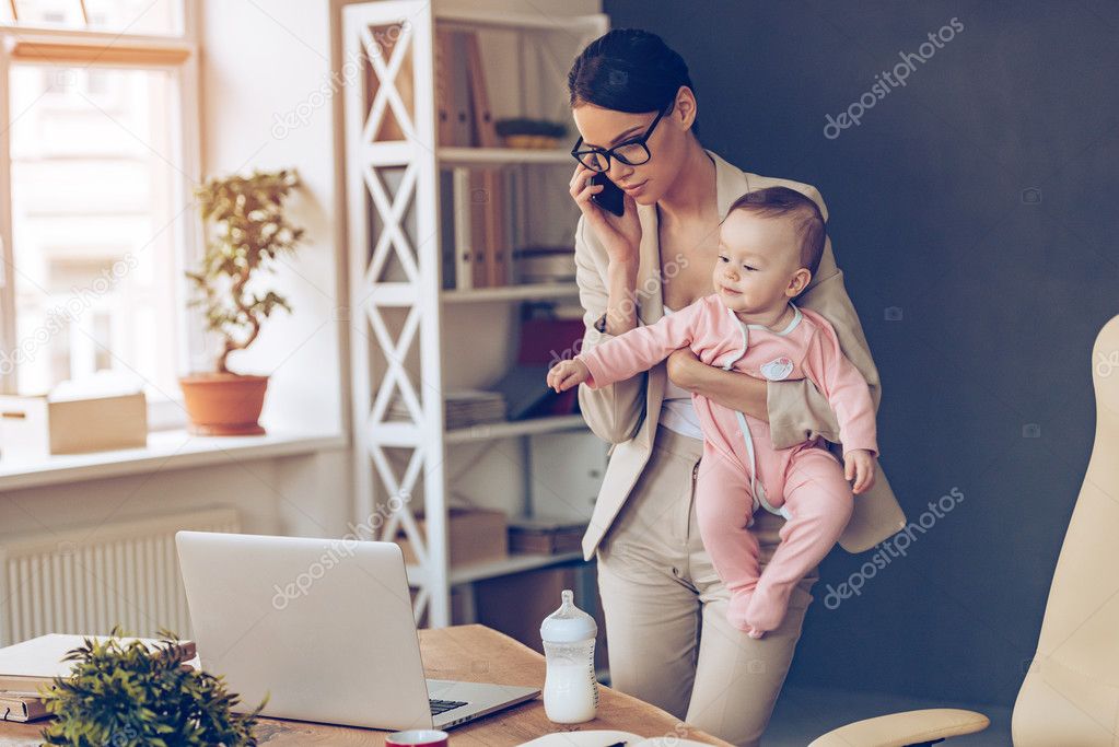 Young businesswoman with baby